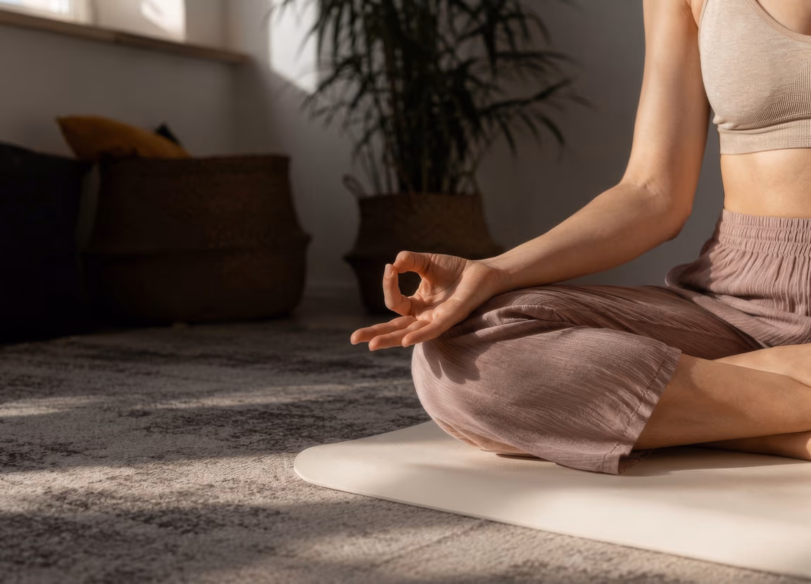 A student seated in a meditation pose